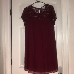 Burgundy dress with lace detail.